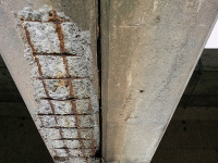 Beams suffering rebar corrosion require rebuild.