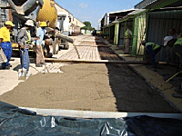 Placing and compacting concrete.